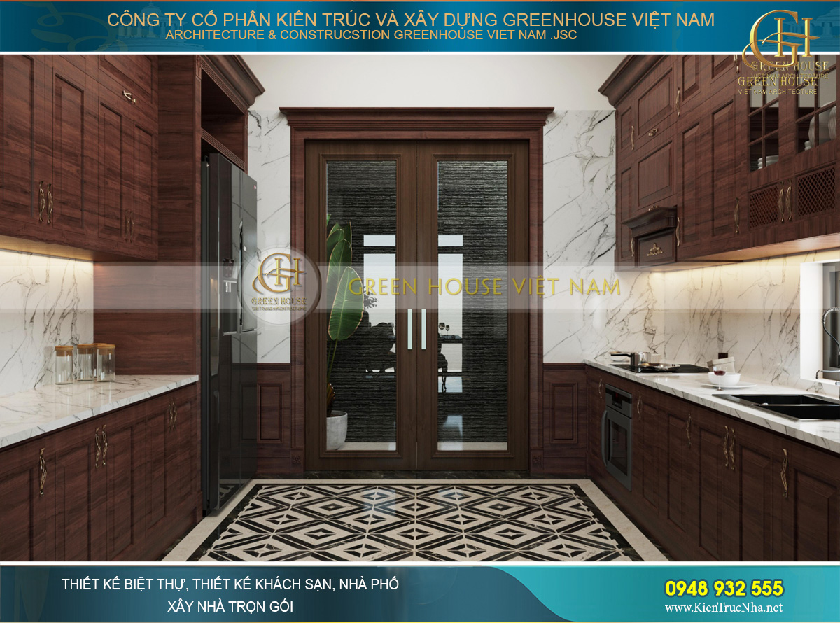 Phía trong là không gian phòng bếp với chất liệu gỗ tự nhiên và đá granite vân mây sáng bóng